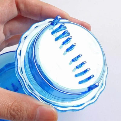 Close-up of the blades inside the blue garlic crusher lid