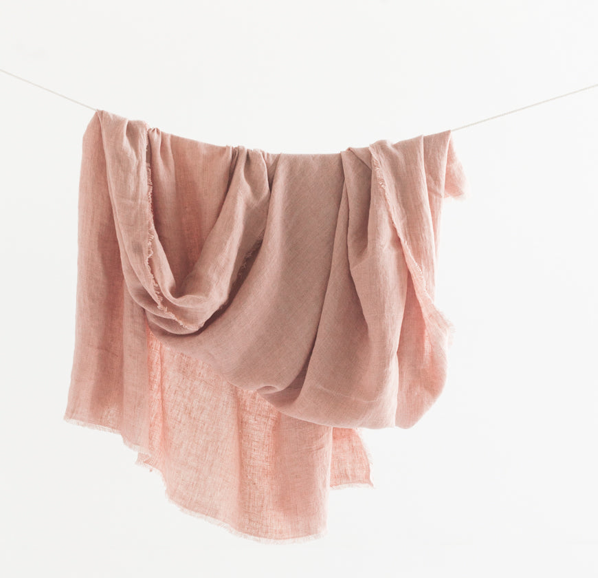 Blush stonewashed linen throw blanket styled at home