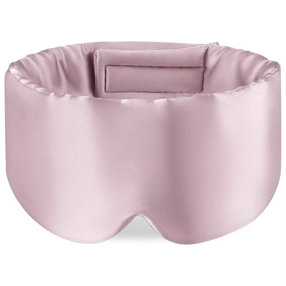 Pink mulberry silk sleep mask on white background