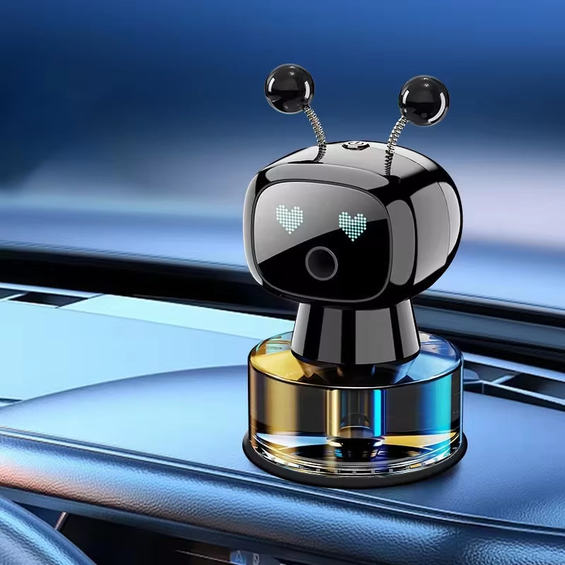 Black robot car aroma diffuser on a car dashboard