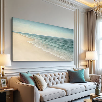 Beach Shoreline II coastal canvas wall art above a tufted sofa