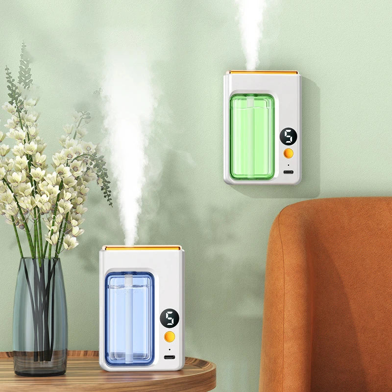 Two automatic aroma diffusers, one wall-mounted and one on a side table, releasing mist