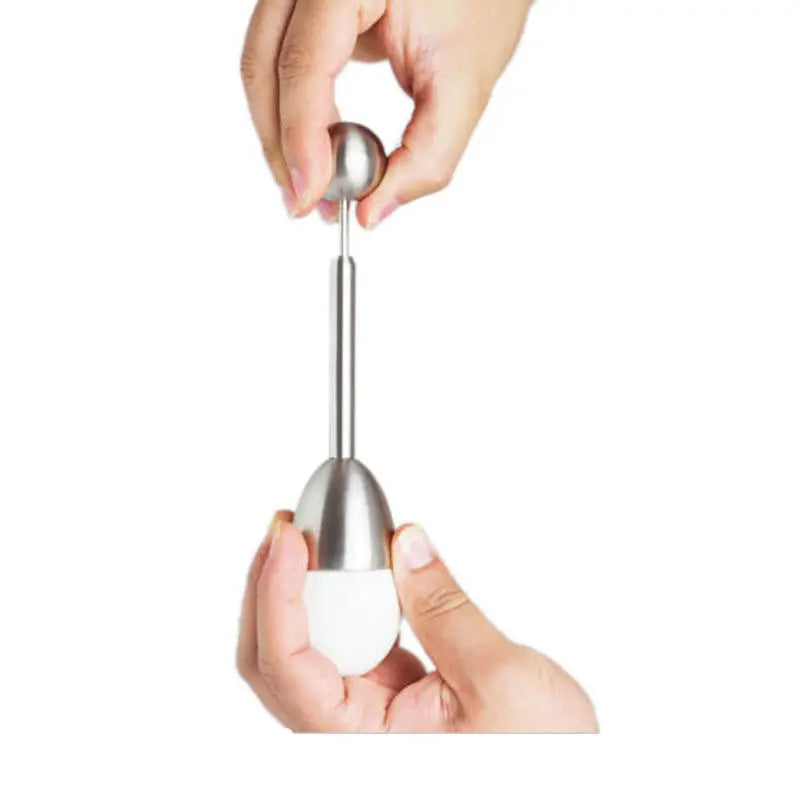 Hand lifting the weighted ball of the egg topper placed over an egg