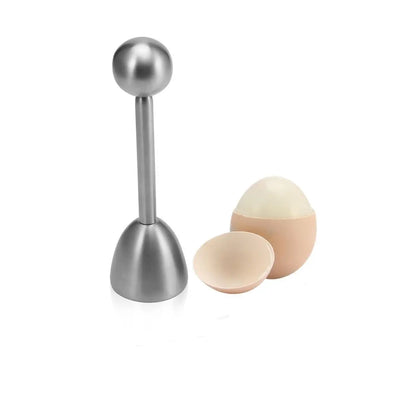 Stainless steel egg topper beside a soft-boiled egg with its top removed