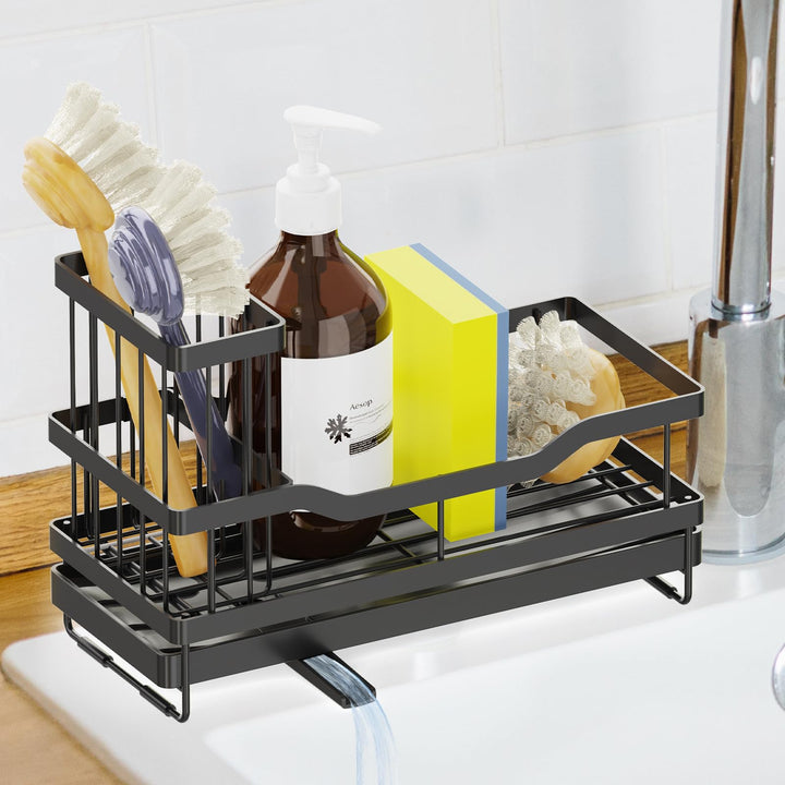Stainless steel sink caddy with a sponge and cleaning supplies on a kitchen counter