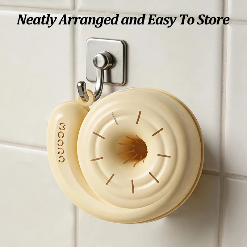 Spin basket hanging on a wall hook by its loop for storage
