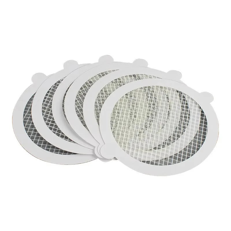 Fanned stack of round drain hair catchers, 6 pieces